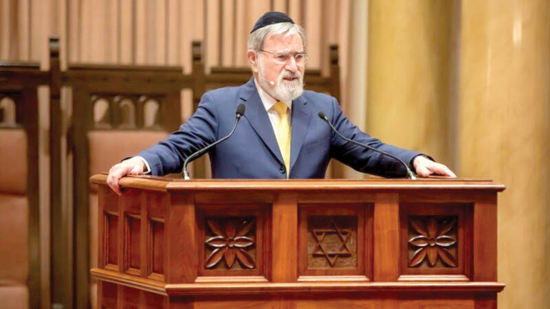 rabbi sacks podium lecturn speaker microphones talk speech shul